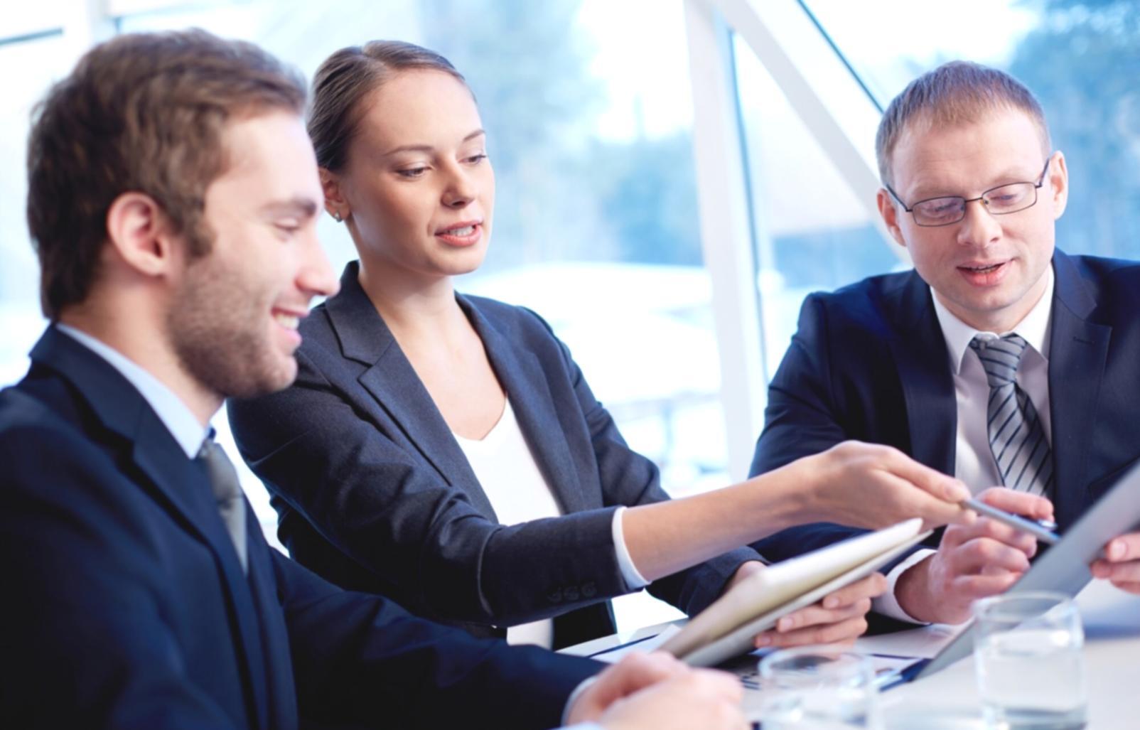 Modern financial technology workspace with multiple screens showing real-time data analytics and market trends