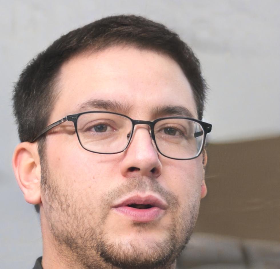 Hamish Kirkland, Lead Financial Technology Consultant, sitting in modern office environment with financial technology displays in background